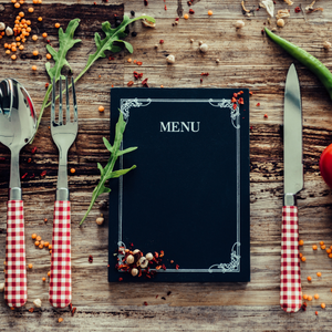 Menu on table with utensils