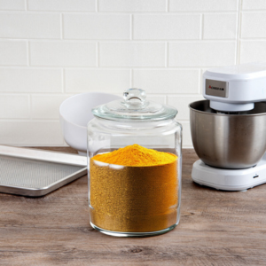 A glass jar with spices inside