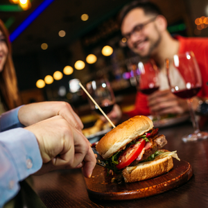 cutting into a hamburger