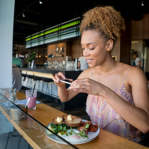 girl taking picture of food