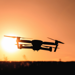 drone in front of a sunset