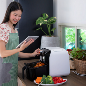 Girl using air fryer