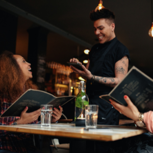 Customer laughing with waiter