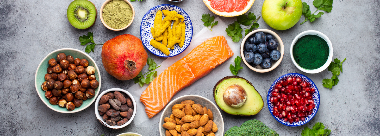 Fruits, nuts, and protein on table