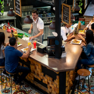 people at counter at food hall